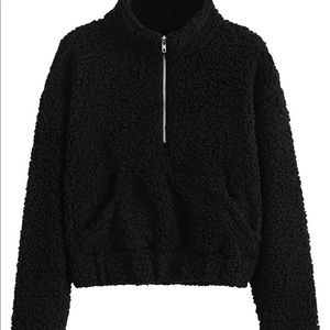 Black fleece cropped sweater. This is in a size Medium.
